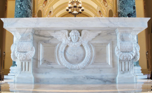 This newly-designed altar made for the renovation of the Cathedral of St. Joseph in Sioux Falls, South Dakota, uses the ornamental motifs of wreath, bundles of leaves and flowers, and the early Christian symbol of the chi-rho to indicate the importance and festivity of the altar. The angel provides “mystical support” for the altar’s mensa. 2011. Duncan Stroik, architect. Cody Swanson, sculptor.